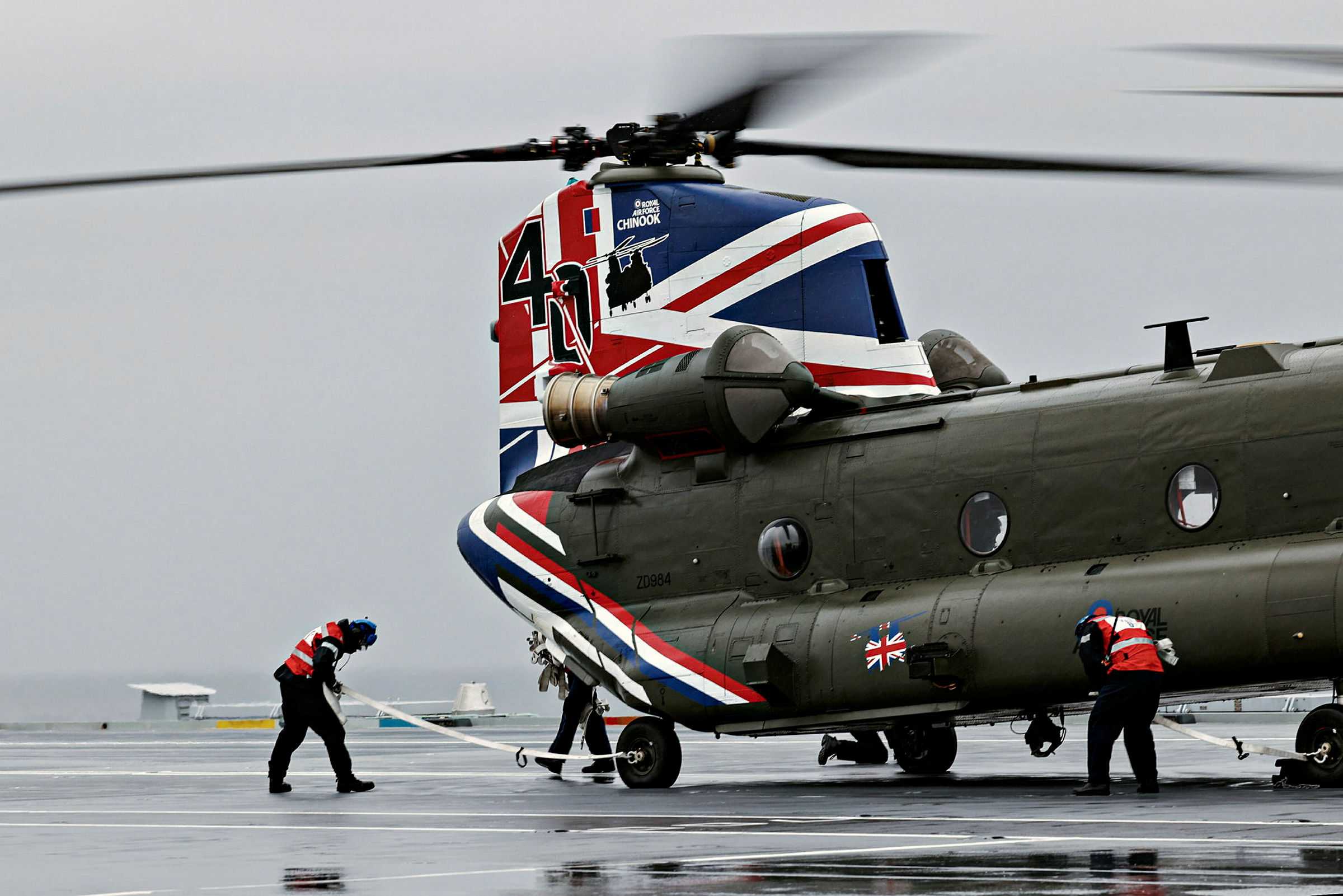 Royal Air Force Odiham celebrated the 40th anniversary of the Chinook helicopter entering RAF Service with a commemorative new colour scheme. Pictured is a Chinook (CH47) from 27 Squadron, RAF Odiham which landed on the flight deck of HMS Prince Of Wales on 12th May 2021. The helicopter displayed the red, white and blue colours to celebrate its 40th anniversary. Throughout its 40 years of service the Chinook has made an immeasurable contribution to the Service, supporting communities across the UK and operating in every major conflict since the Falklands War.